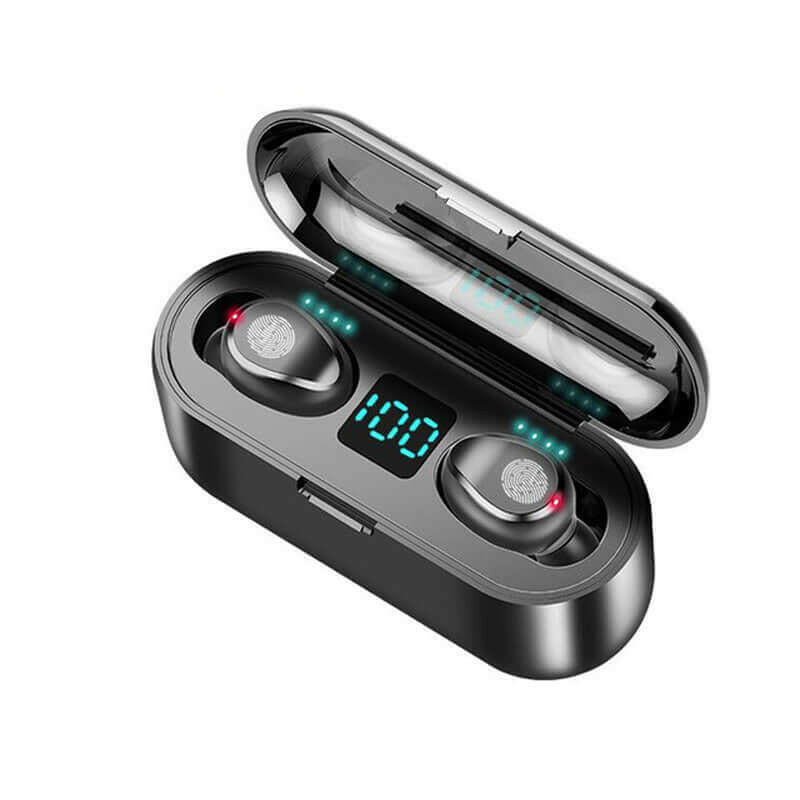 Close-up of black Bluetooth headphones in their charging case, featuring a digital screen for battery status, ideal for sports enthusiasts.