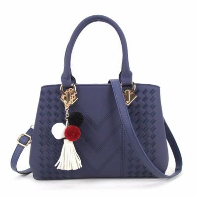 Navy blue luxury handbag for women that combines style and functionality, complete with colorful accessory.