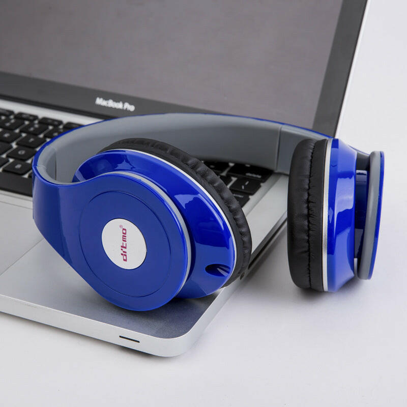 Bright blue wired gaming headphones resting on a laptop, designed for style and comfort.