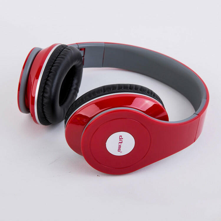 Striking red gaming headphones laid out to showcase their soft ear pads and stylish look.