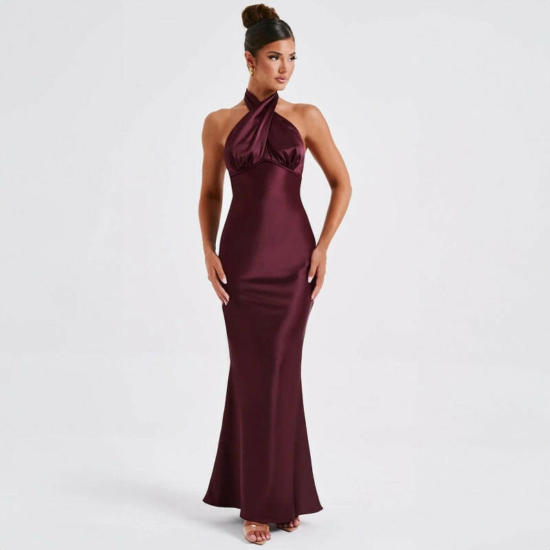 Elegant model in a burgundy summer backless dress, highlighting the flowing style and sleeveless cut.