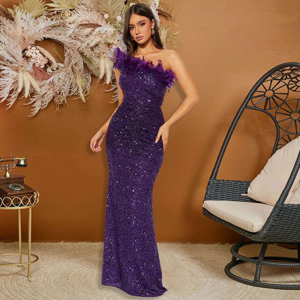 A model poses in a beautiful purple sequin evening dress featuring a trendy feather neckline, set in a stylish environment.