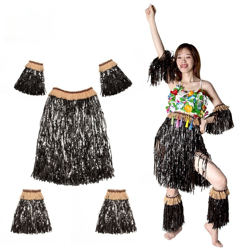 A woman dancing joyfully while wearing a black Hawaiian grass skirt outfit with colorful floral decorations.